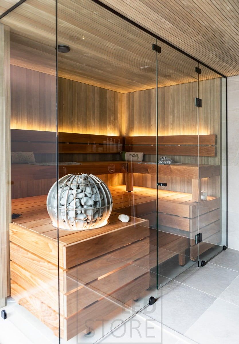 Ambient lighting for the sauna created by indirect light, with the LED strip on the backrest facing upwards and under the bench facing downwards. Ledstore.fi