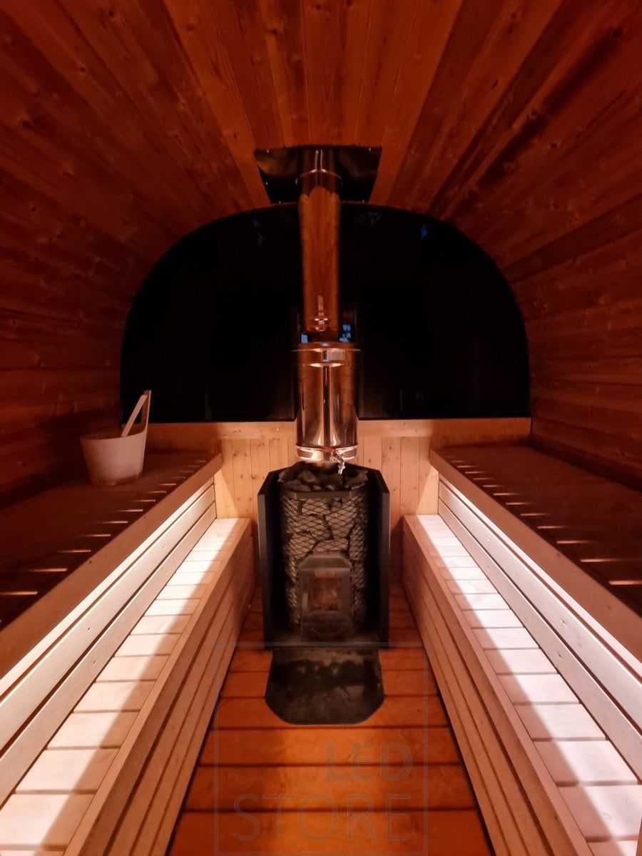 Ambient lighting for sauna created with indirect light, led strip under benches. Ledstore.fi