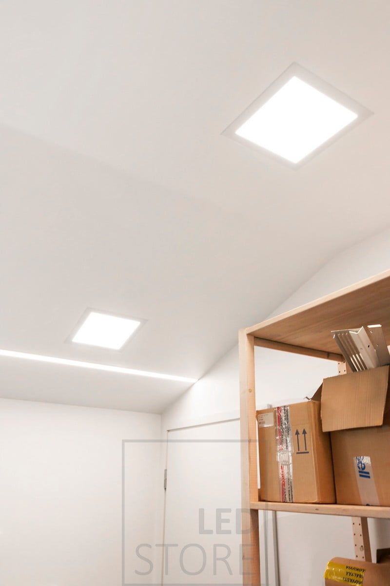Recessed panel luminaires combined with a wide recessed profile with two LED strip lights. Ledstore.fi