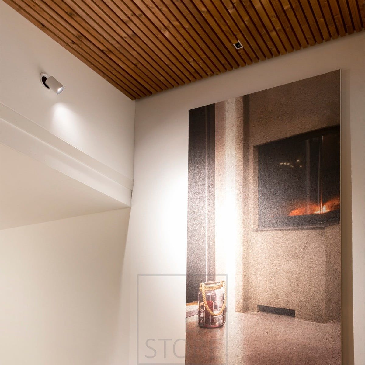 KOLO led spotlight embedded in the wall, illuminating a painting. The KOLO spotlight is retractable and retractable. Ledstore.fi