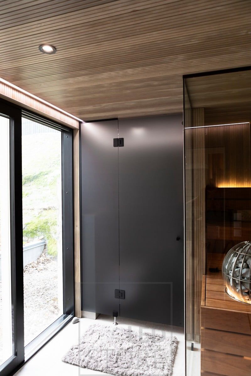 On the ceiling led spotlight 023 in black and above the windows led strip in a narrow flush profile. Ledstore.fi