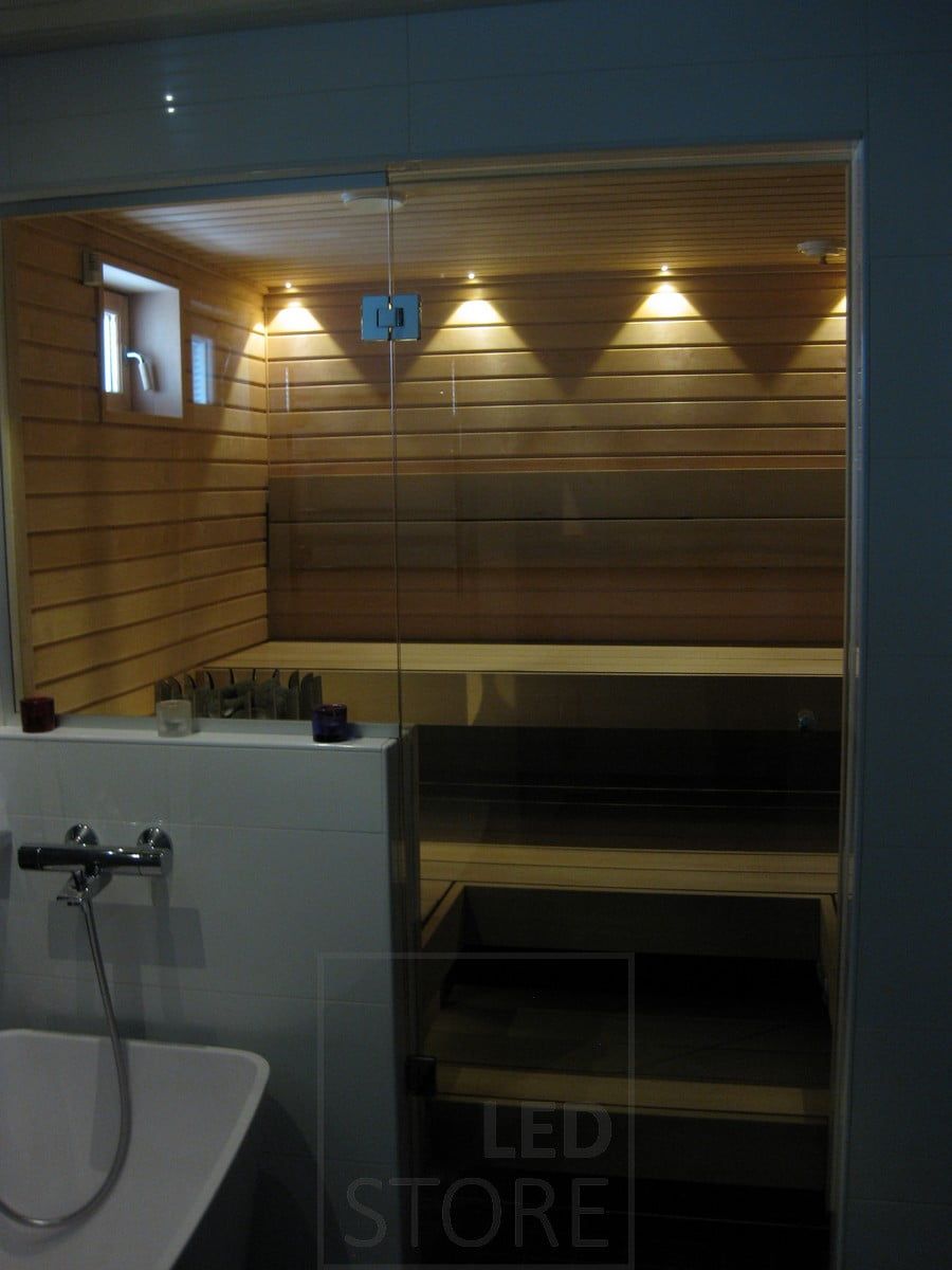 Led spots in sauna. The colour of the light matches the wooden panels of the sauna with a warm white lighting of 3 000 Kelvin. Ledstore.fi