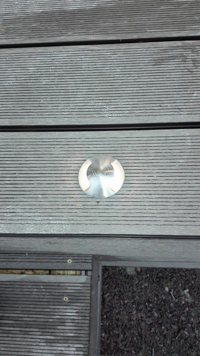 Two-way illuminated outdoor spotlight, embedded in a terrace. Indirect light through the terrace. Ledstore.fi