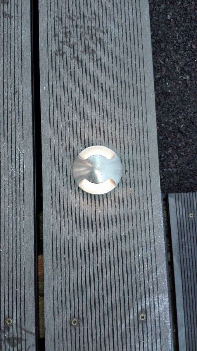 A patio pot embedded in the decking. The light illuminates in two directions through the terrace. Ledstore.fi