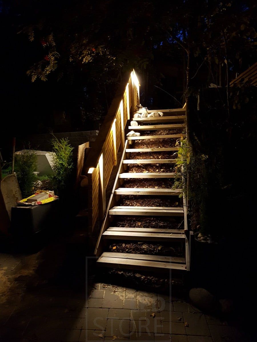 Led strip light outdoors illuminating indirect light on an outdoor stair railing. Ledstore.fi