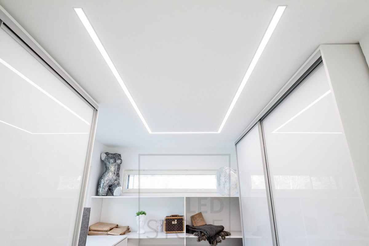 Wide recessed profile in the wardrobe with two LED strips, recessed profile shaped to the ceiling according to the room and the need. Ledstore.fi