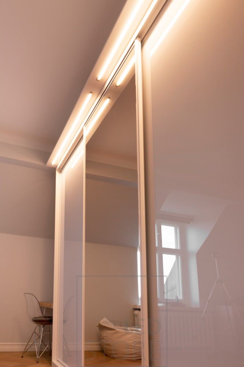 In a drawer built on top of a wardrobe, LED light strips in an uppo profile illuminate the wardrobe and its surroundings. Ledstore.fi