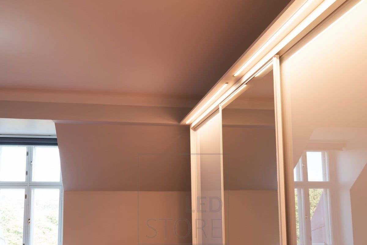 In a drawer built on top of a wardrobe, LED strips in the flush profile illuminate the wardrobe and its surroundings. Ledstore.fi