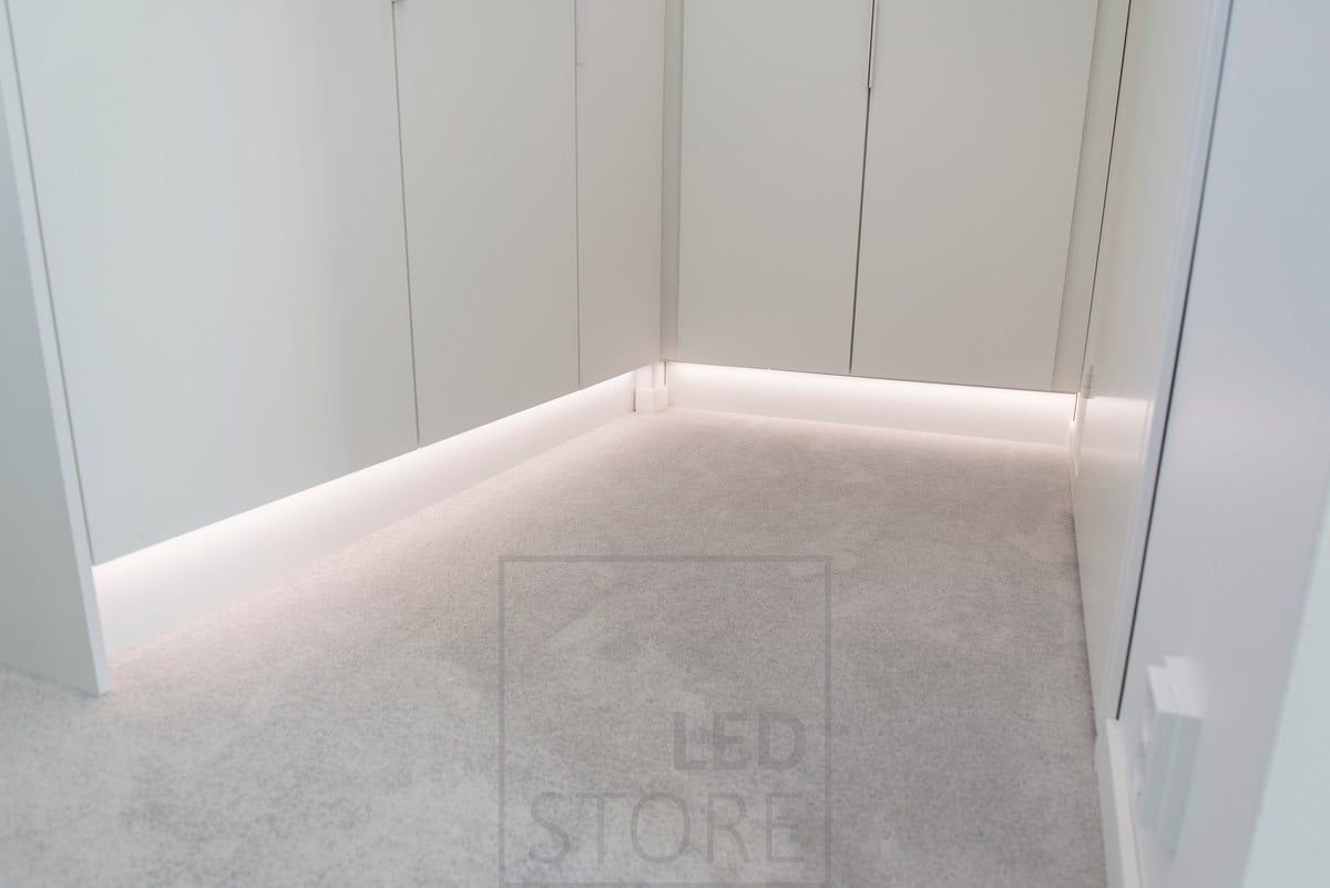 Indirect lighting of a wardrobe with a LED strip light on the plinth. Ledstore.fi