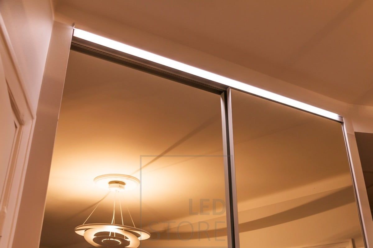 LED strip on the wardrobe drawer, illuminating the mirror and the inside of the wardrobe with indirect light. Ledstore.fi