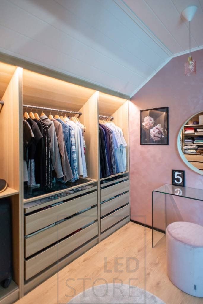 Wardrobe lighting with Led strip lighting. The Led strips are mounted behind the decorative strip and the light is directed inside the wardrobe. Ledstore.fi