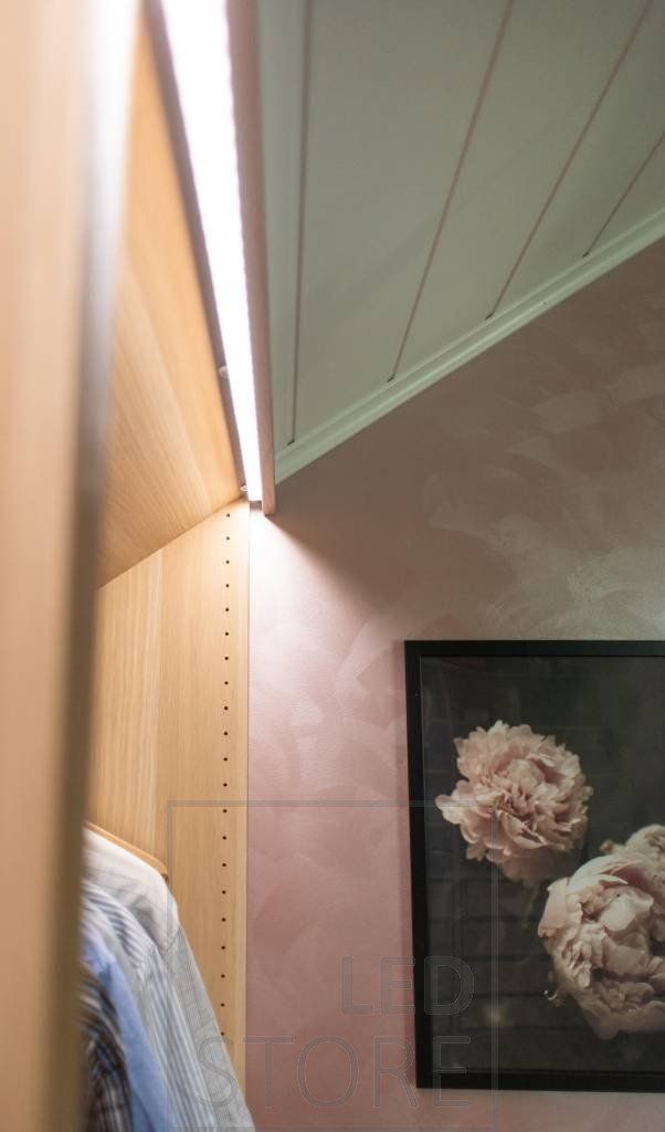 Led strip on the front of the wardrobes, hidden behind the moulding and directed inside the wardrobe. The solution creates atmospheric light and increases the comfort of use in the wardrobe. Ledstore.fi
