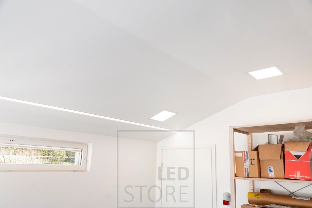 Panel luminaire combined with a wide recessed profile to provide good general lighting in the garage. Ledstore.fi