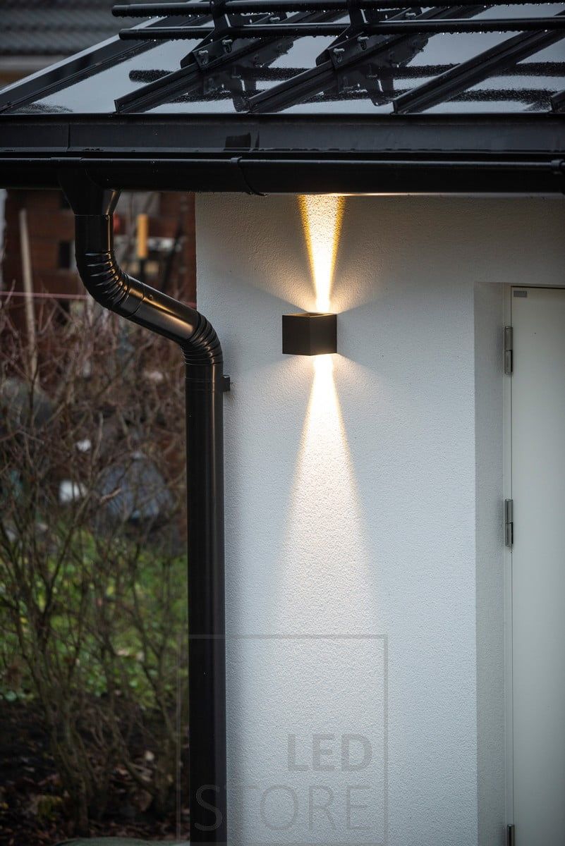 FUNK wall lamp for two-way lighting in a warehouse wall. Ledstore.fi