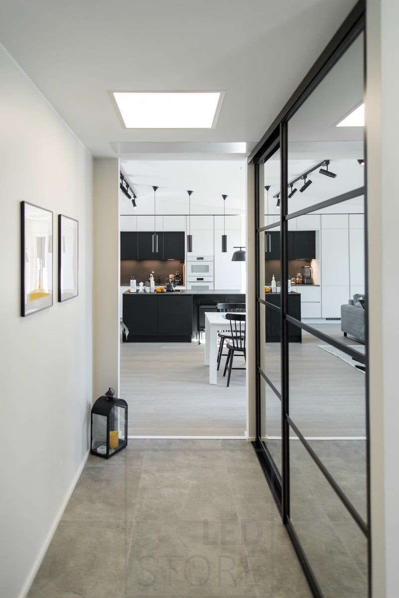 A panel light fixture in the hallway resembling a skylight. Ledstore.fi