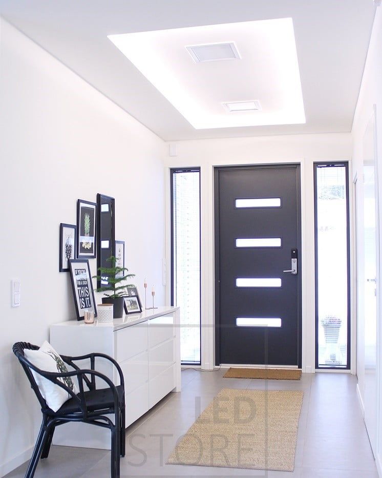 In the hallway, an LED strip wraps around the ceiling to create a beautiful and impressive light canopy. Ledstore.fi