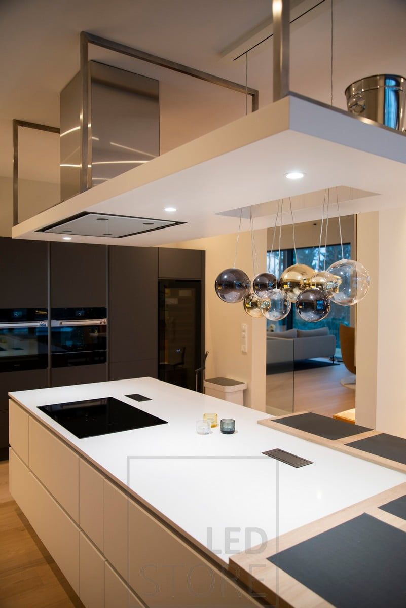 Lighting of the kitchen island realized with spotlights. Ledstore.fi
