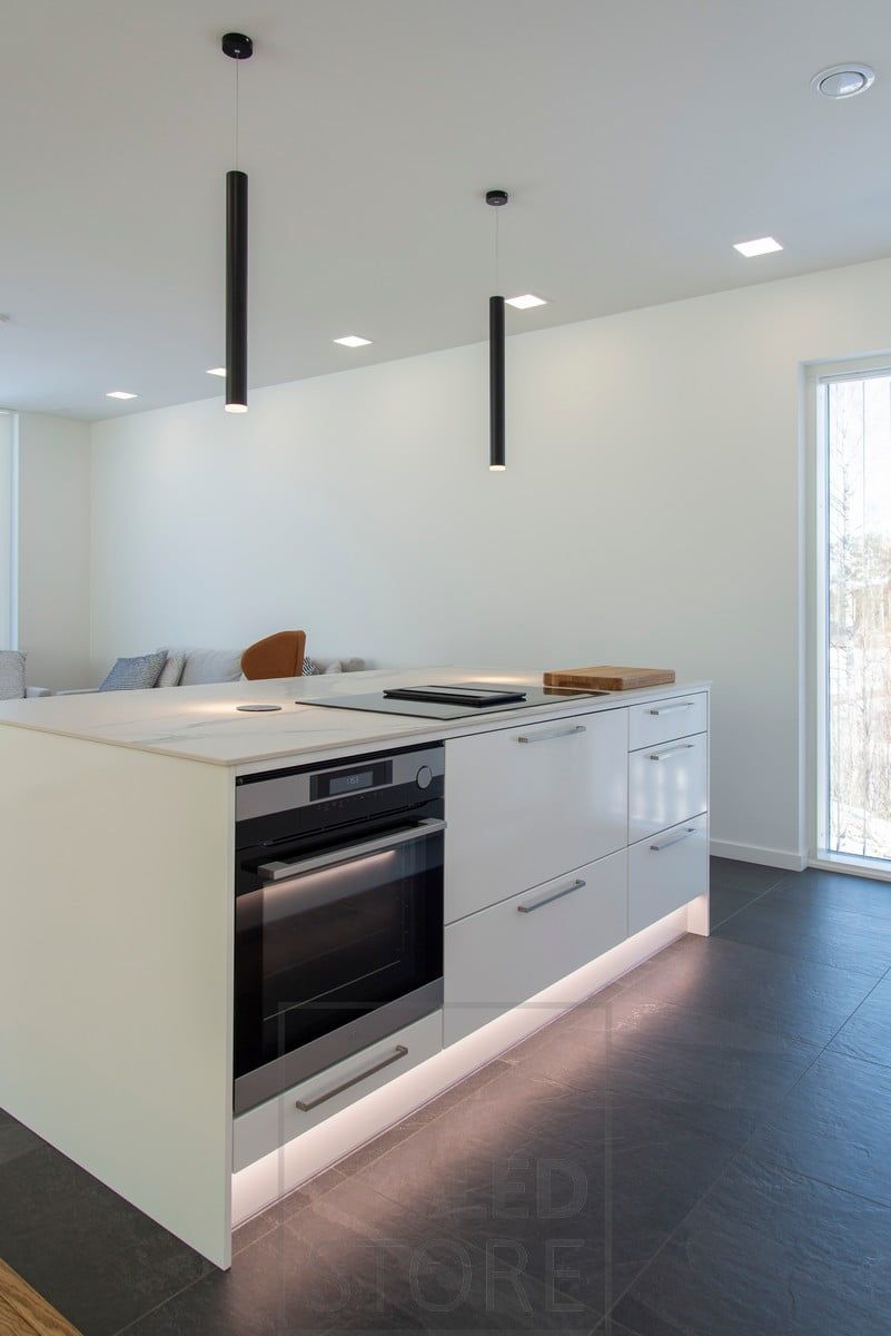 Panels on the ceiling, chimney pendant lights on the top of the level and a LED strip as mood and night light on the plinth. Ledstore.fi
