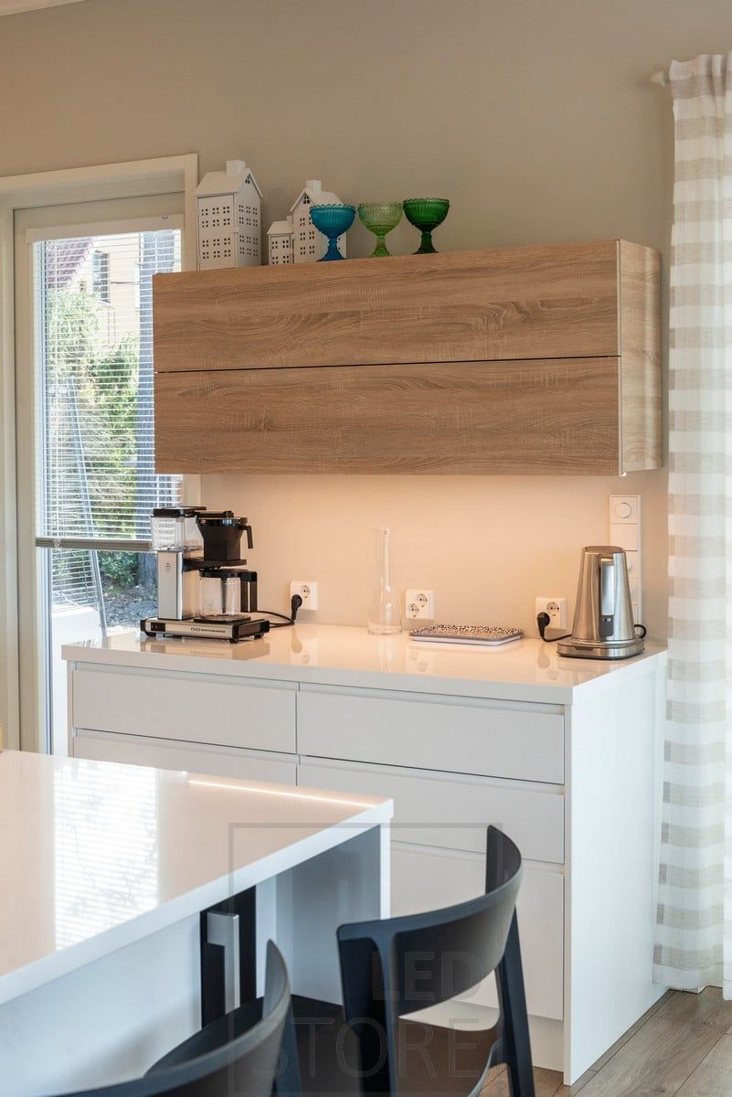LED profile mounted on the bottom of a cabinet, illuminating the worktop. Ledstore.fi
