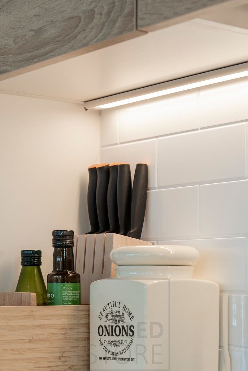 Close-up of a task light. Light in a wide surface profile that can accommodate 2 strips. Ledstore.fi