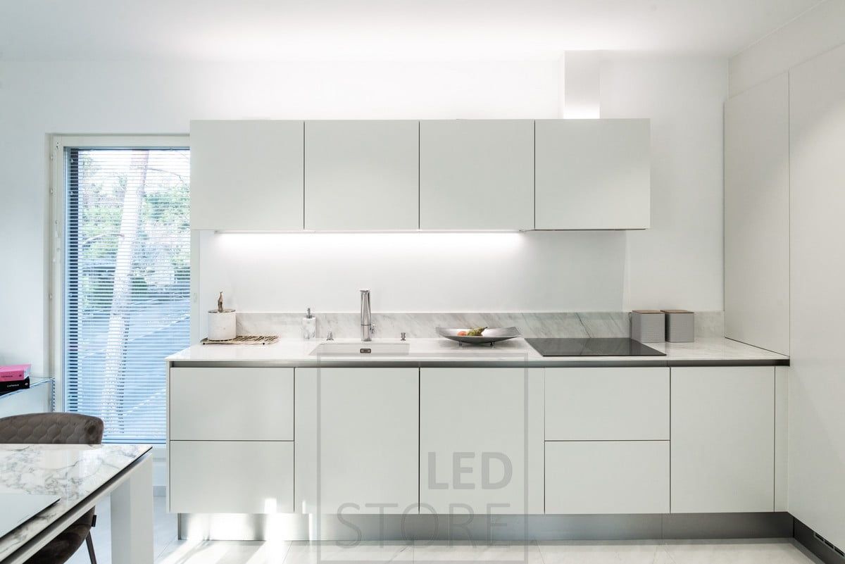 In the kitchen, a flat light fixed to the bottom of the cupboard and another led strip providing indirect light on top of the cupboards. Ledstore.fi