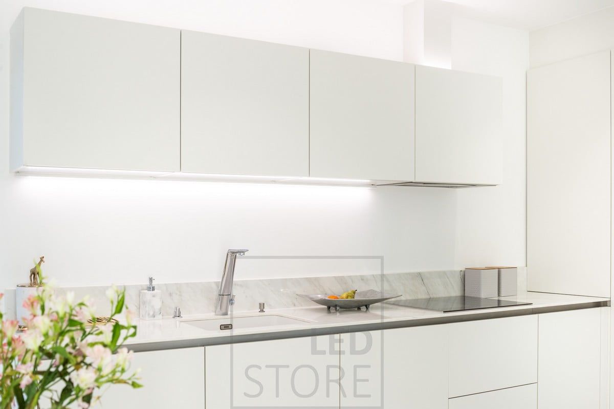 In the kitchen, the cabinets were used for lighting, with a work light attached to the bottom of the cabinet and another led strip providing indirect light on top of the cabinets. Ledstore.fi