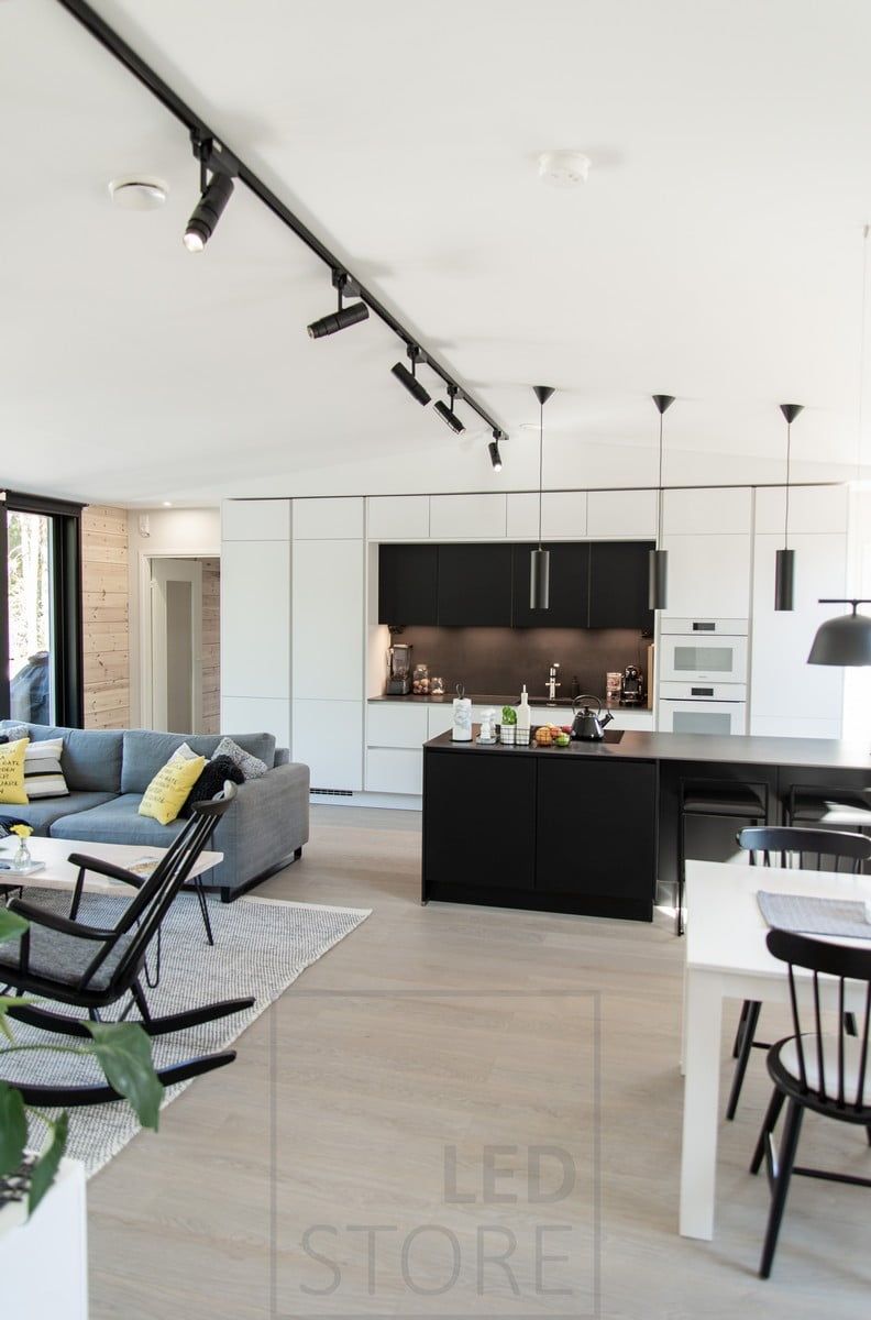 In the open floor plan, versatile lighting implemented with three-phase track, pendant lights and LED strips. Ledstore.fi