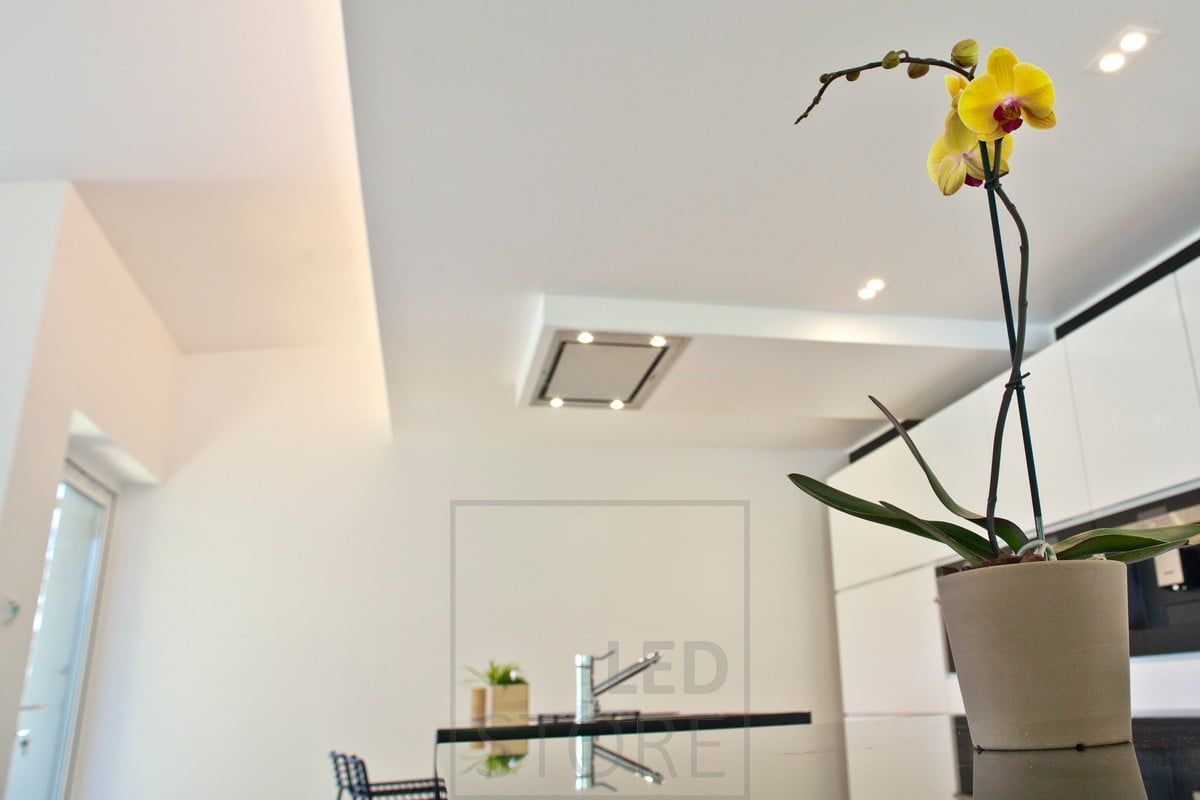Spot lighting in the kitchen and indirect light in the downstairs lip. Ledstore.fi