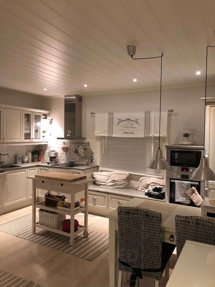 Kitchen lighting with led spots on the edge of the room and pendant lights on the dining table. Ledstore.fi