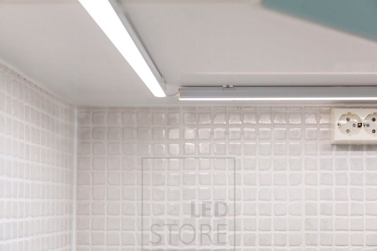 Close-up of a countertop led lighting. The taller surface profile has a led strip inside, the angled wire allows for a slightly freer placement of the profiles. Ledstore.fi