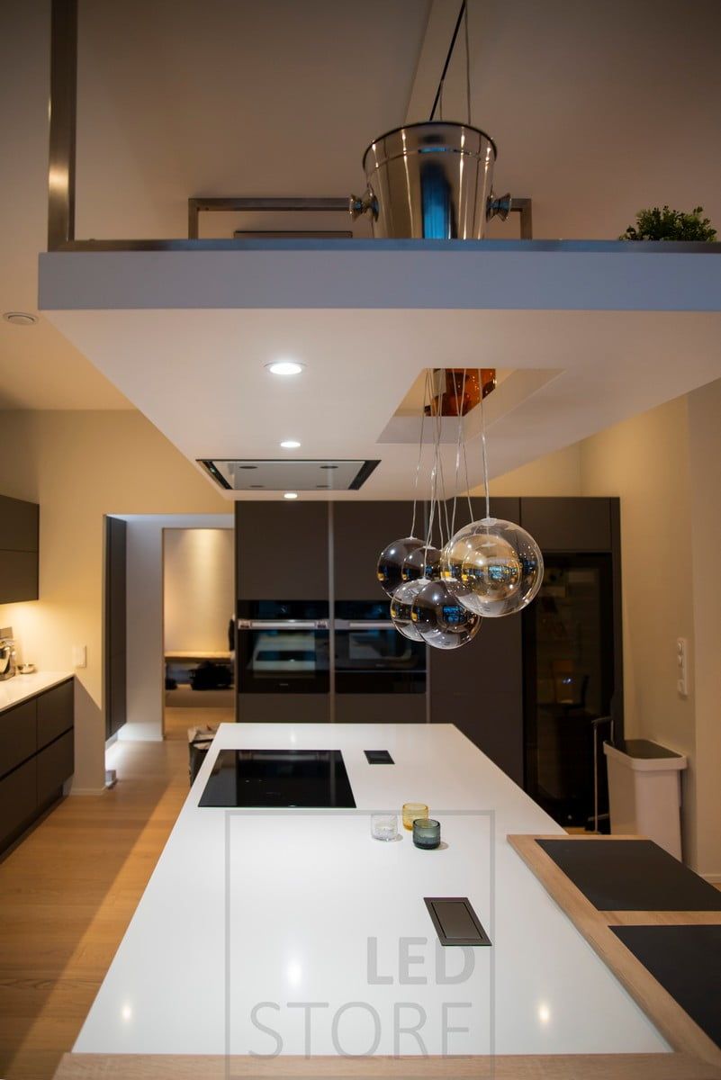 A good working light with spotlights on top of the kitchen island. Ledstore.fi