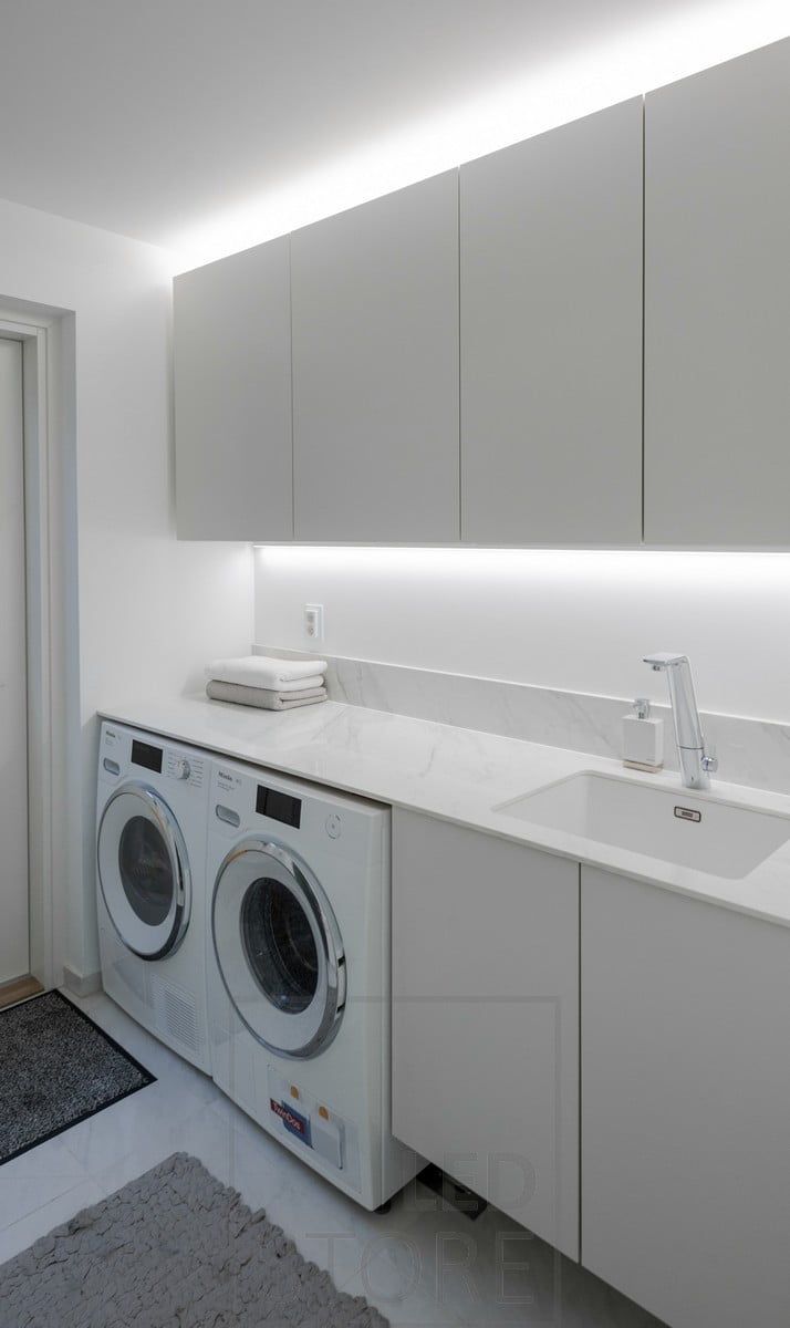 Led strip to bring light to the level and a led strip on top of the cabinets to create indirect light. Ledstore.fi
