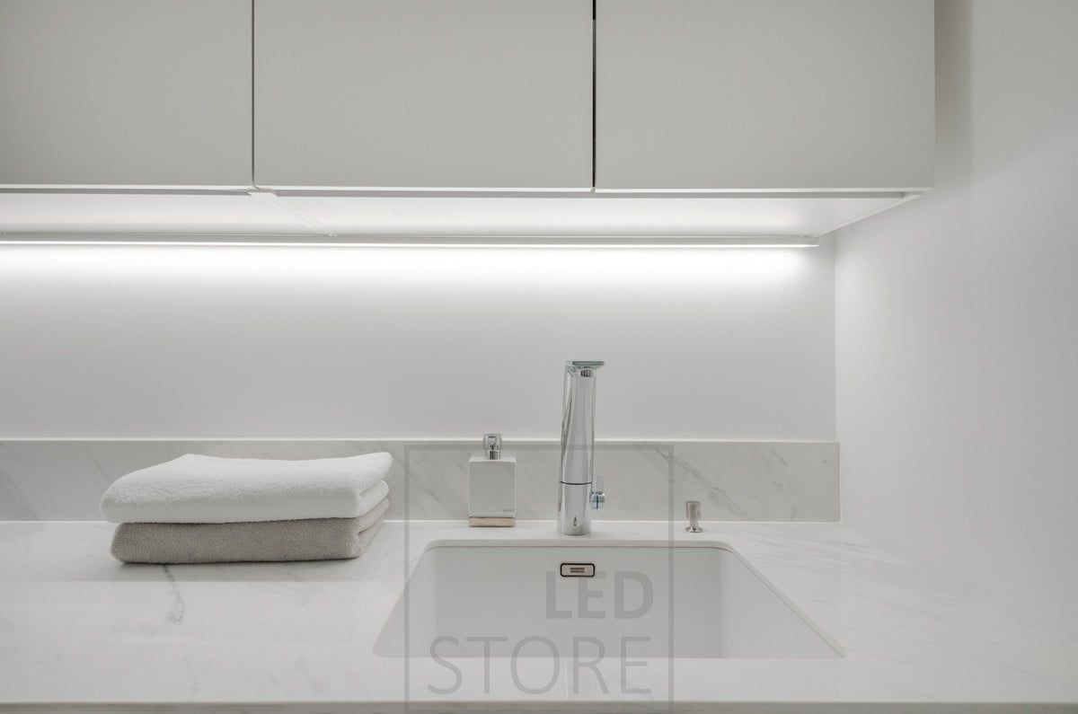In the corner of the wall and the cabinet, a led strip in the surface profile brings light to the level. Ledstore.fi