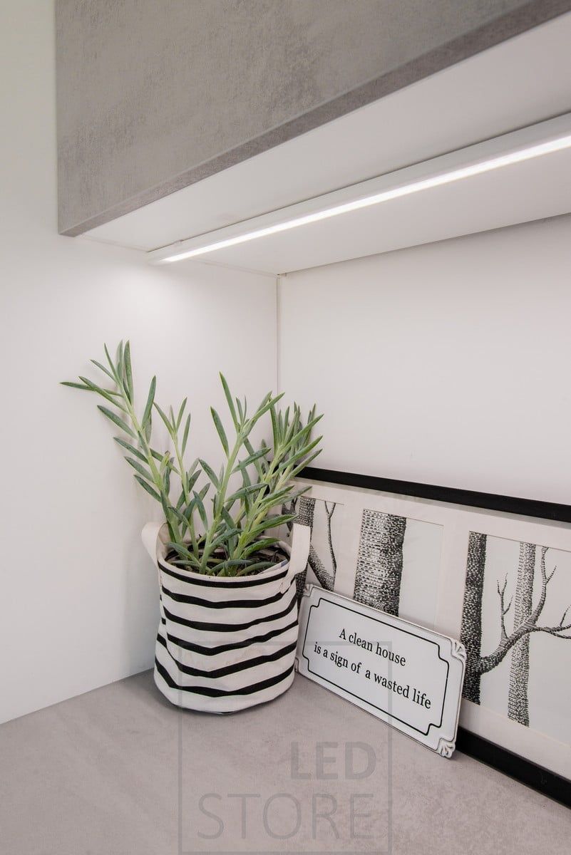 In the utility room, a LED strip mounted on a surface profile provides working light on the worktop. Ledstore.fi
