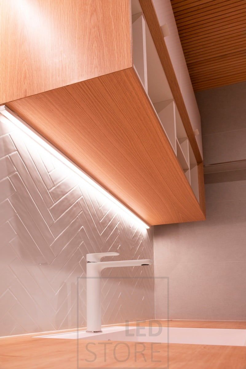 In the corner of the cabinet, an LED strip highlights the tile and brings in working light. Ledstore.fi