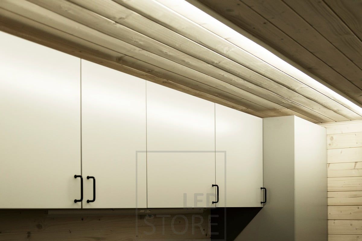 A directional surface-mounted led profile on the ceiling of the space illuminates well the fixed furniture in the utility room. Ledstore.fi