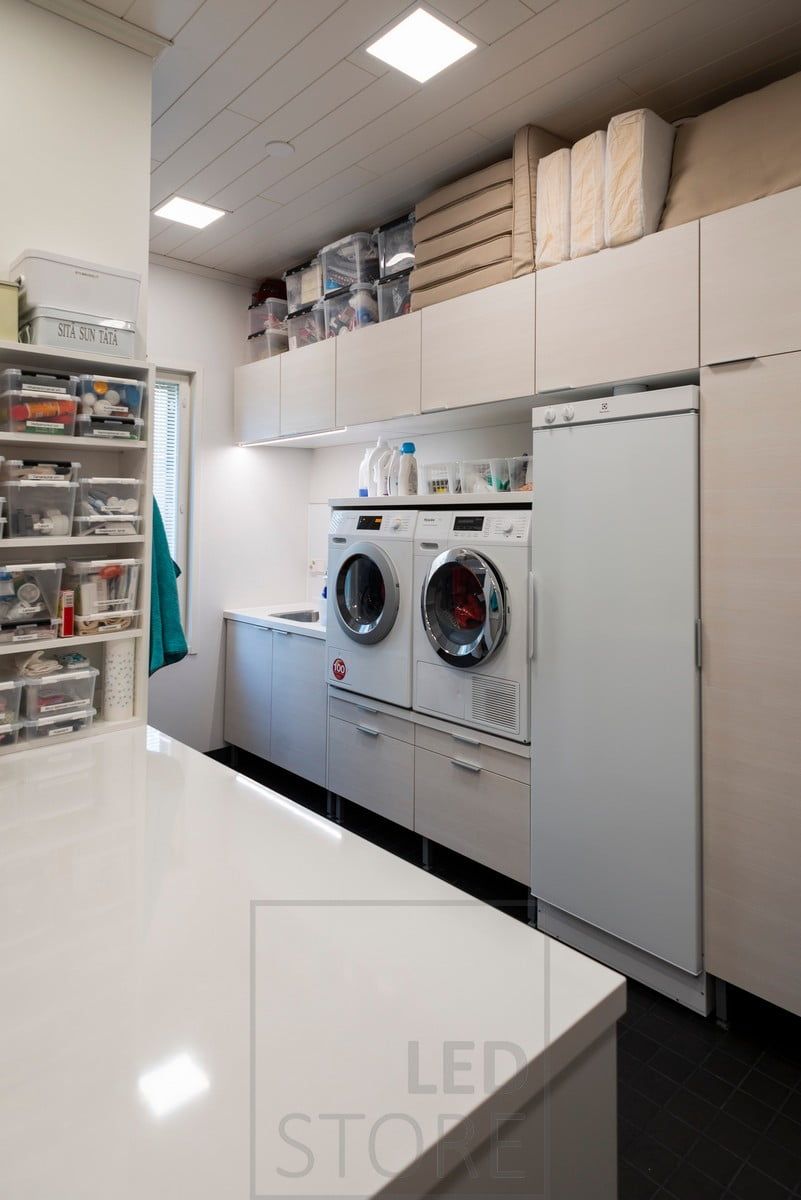 A utility room with panel lamps on the ceiling illuminating the space evenly and efficiently. Ledstore.fi