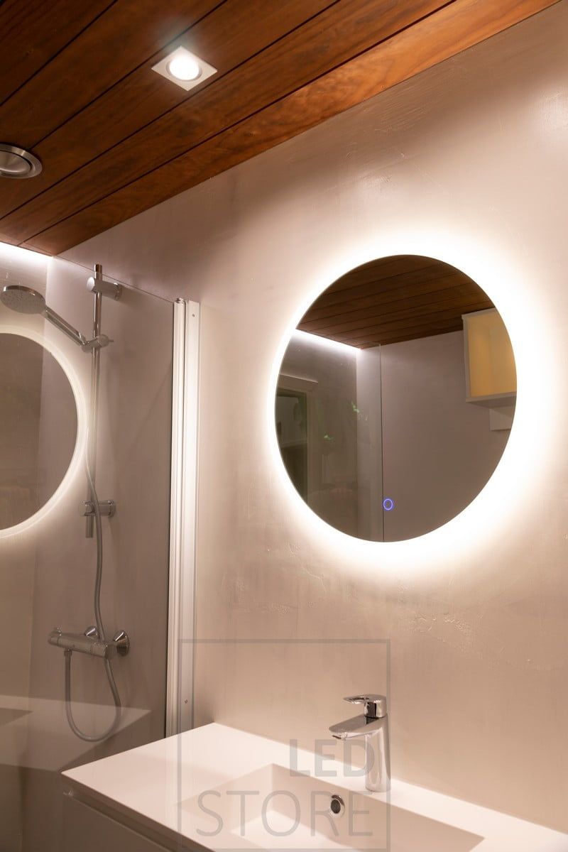 Round light mirror in the bathroom. The spots are positioned to illuminate the face from above and this creates an excellent shaving and make-up light. Ledstore.fi