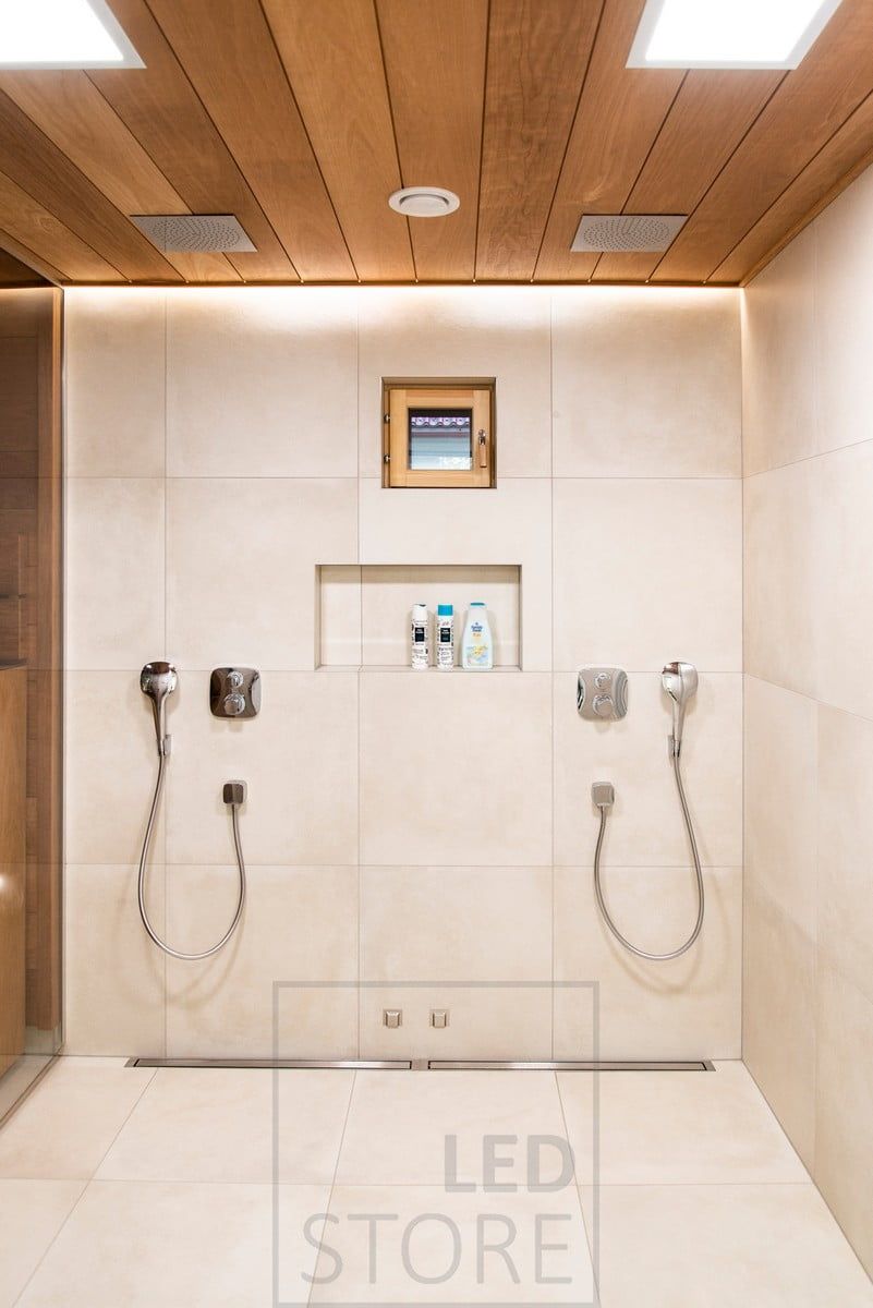 In the washroom, two panel lights combined with a led strip behind the shower. Ledstore.fi