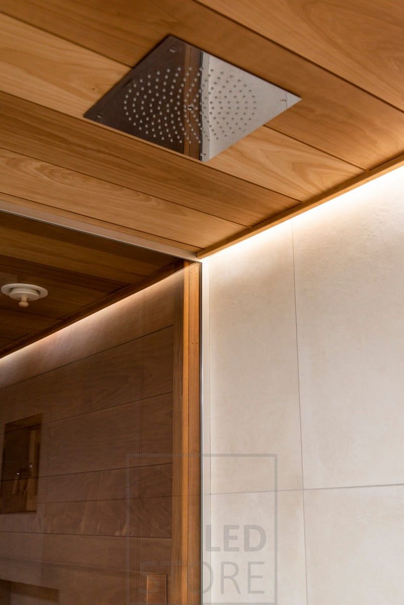 Behind the showerhead, a LED strip illuminates the washroom with atmospheric, indirect light. Ledstore.fi