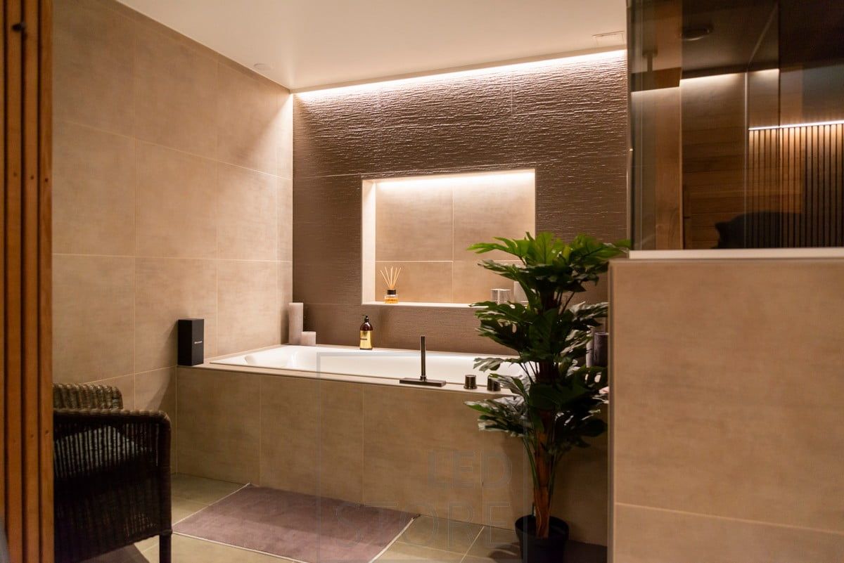 Indirect light in the spa area. Led strip between ceiling and wall and in the upper corner of the shelf. Ledstore.fi