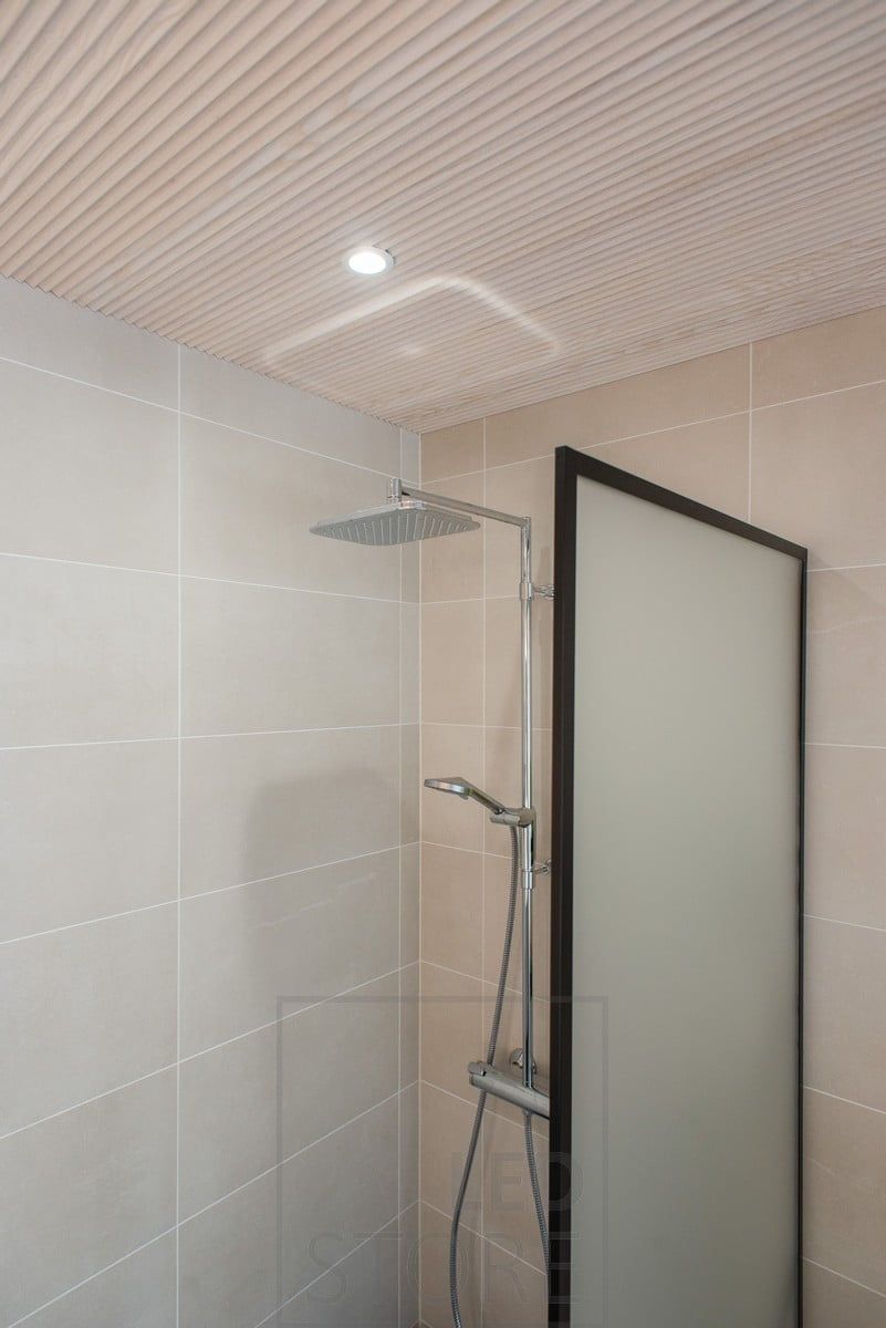 Ceiling spotlight illuminating a shower. Ledstore.fi