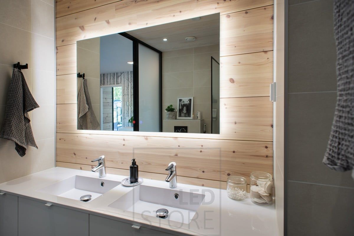 In the bathroom, light from behind a 1200mmx750mm light mirror highlights the beautiful wood panelling and opens up the space. Ledstore.fi
