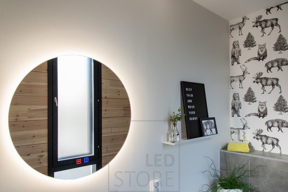 A circular light mirror illuminates indirect light through a wall. Ledstore.fi