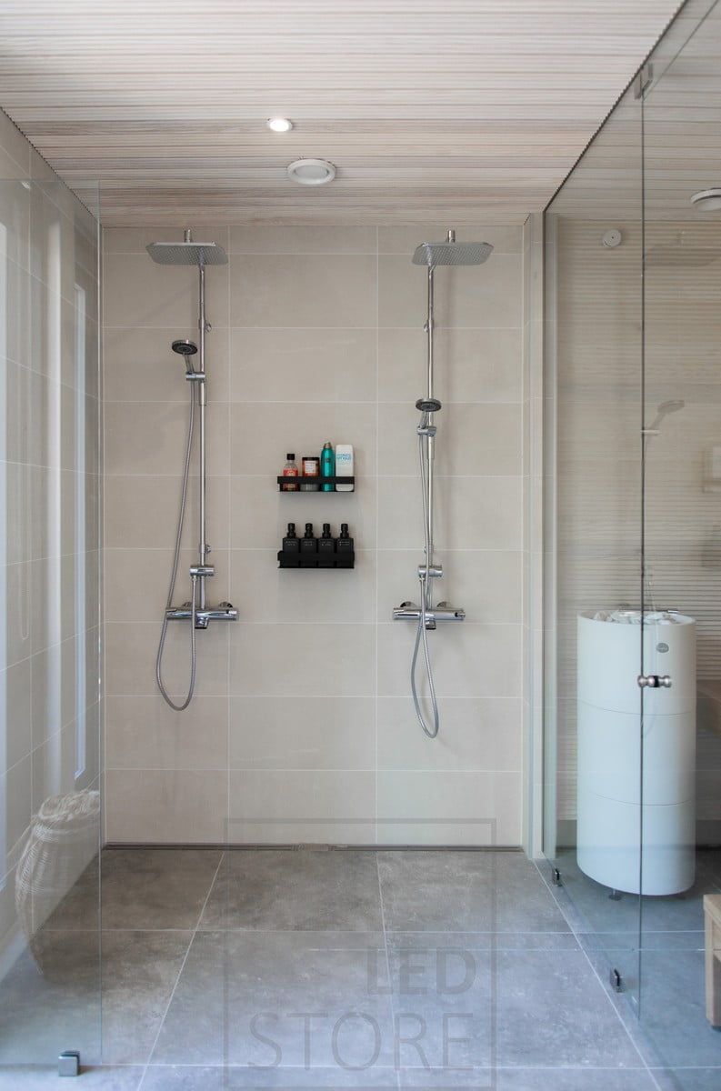 In the washroom, spotlights on the shower's centre line illuminate the shower area. Ledstore.fi