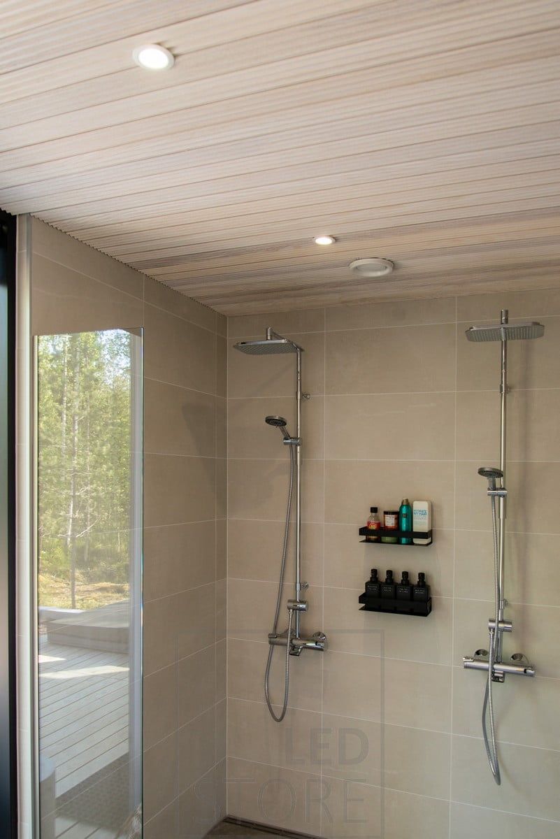 White spots on the ceiling illuminating the shower area. Ledstore.fi
