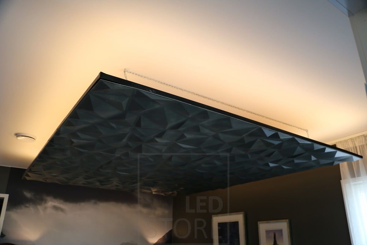 An LED strip around the lower landing, moodily illuminating the space through the ceiling with indirect light. Ledstore.fi