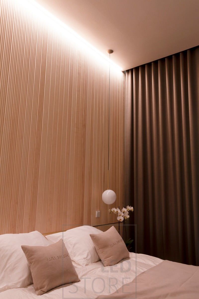 In the bedroom, mood lighting behind the bed in the ceiling highlights the beautiful panelling. Led strips in the wide flush profile. Ledstore.fi