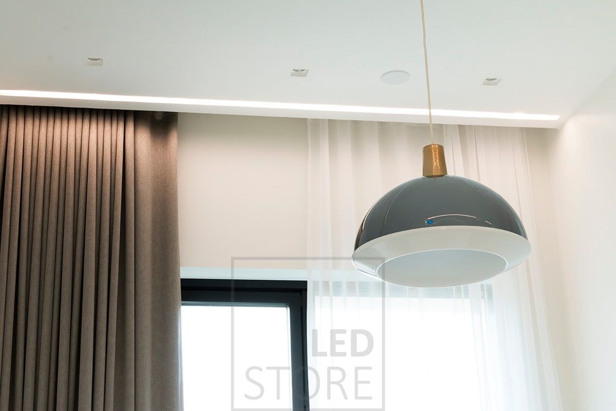 In the bedroom, a wide flush-mounted profile next to the curtains provides mood lighting. The wide flush-mounted profile can accommodate two LED strips side by side. Ledstore.fi