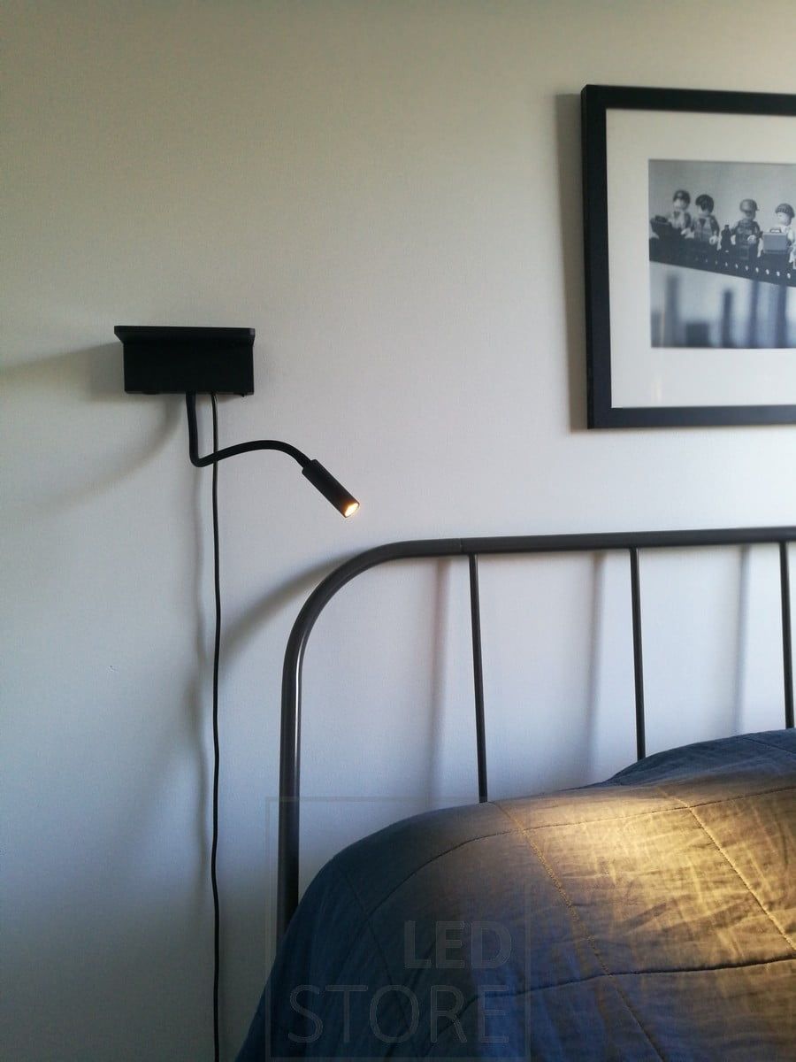BLADE wall lamp at the head of the bed. It functions as a reading light and has both wired and wireless charging for your phone. Ledstore.fi